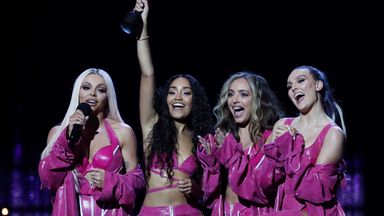 Little Mix accepting an award at the Brits.